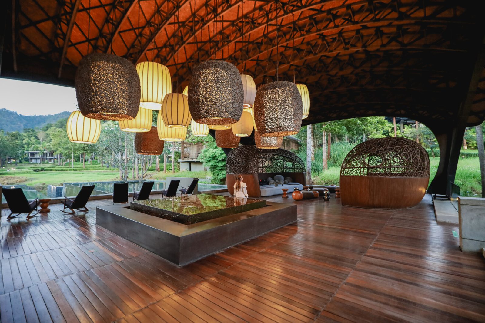 A lounge under a woven roof