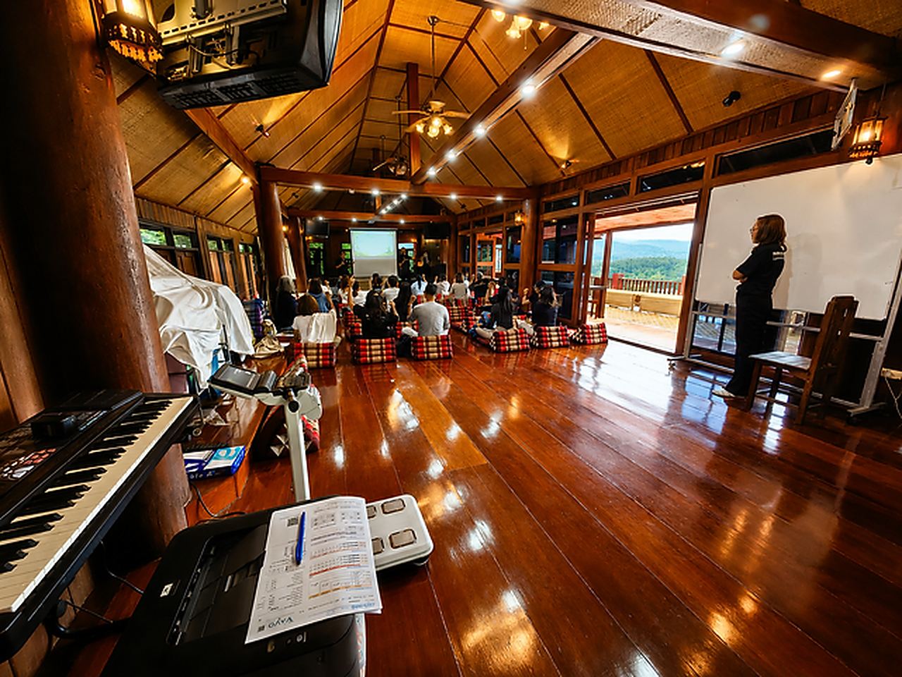 The long open teak hall where the sessions are held