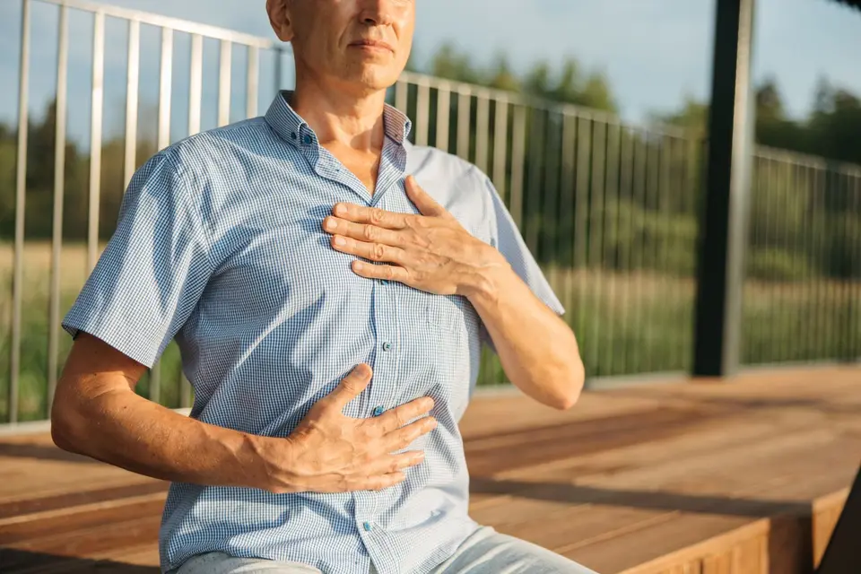 Breathwork with a hand on the chest and belly